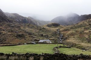 gray house surrounded with mountain